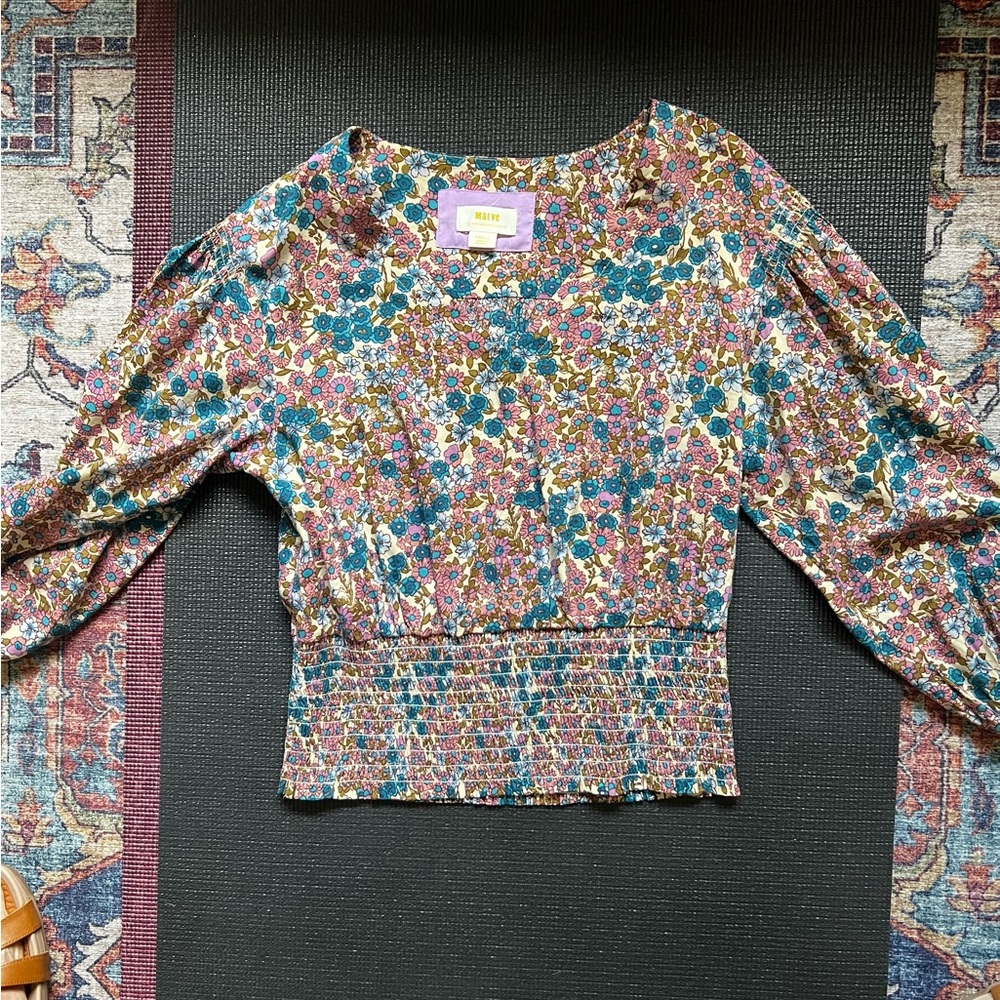 Beautiful top by Anthropologie.Worn once because it was to small on me